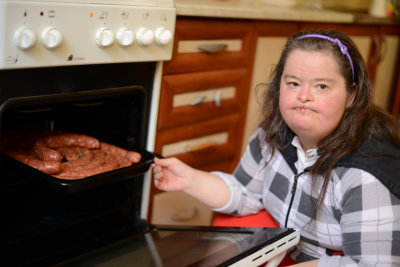 woman with down syndrome cooking