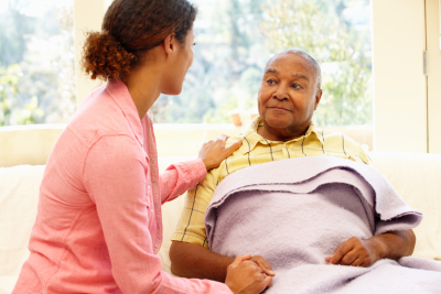 caregiver attending to her senior patient